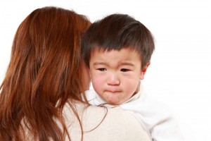 mom discipling crying boy